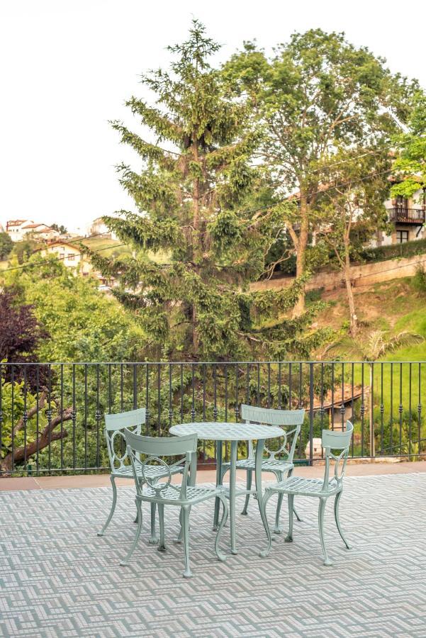 Apartamentos Boutique Fuente Real Comillas Eksteriør billede